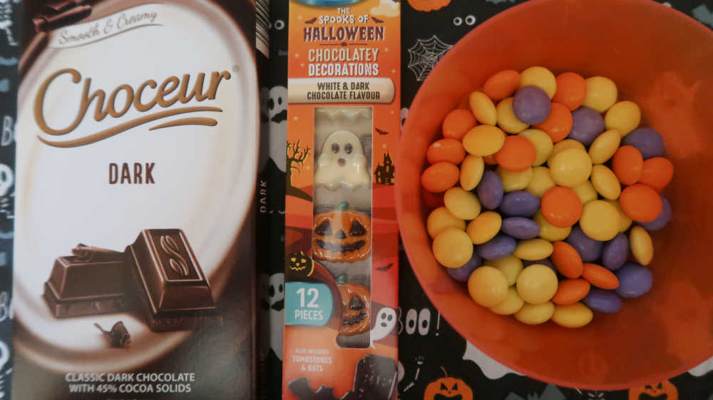 Dark chocolate and halloween candies for the toppings