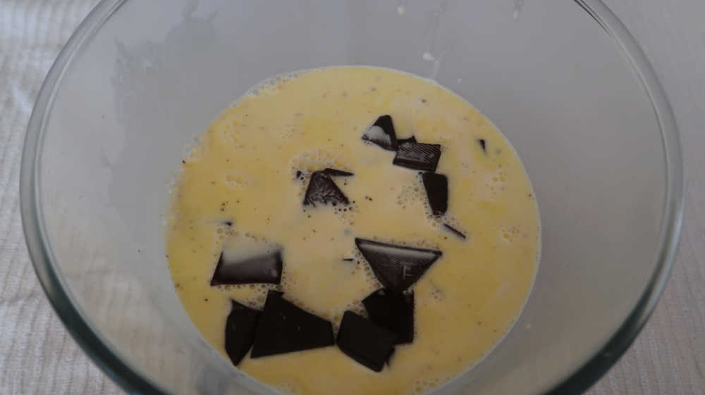 Heavy cream poured over the chopped chocolate