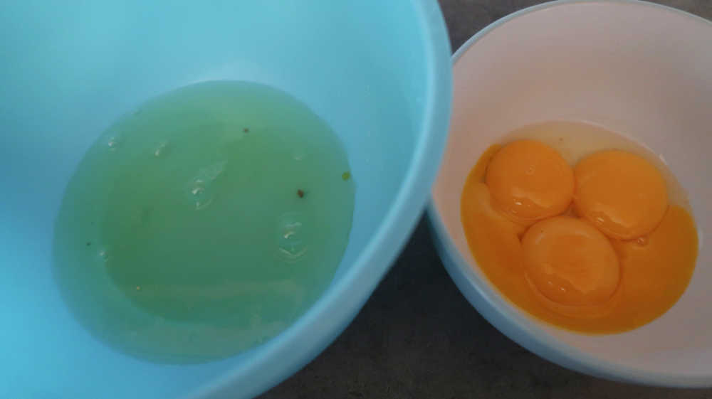 The 4 eggs separated into 2 bowls