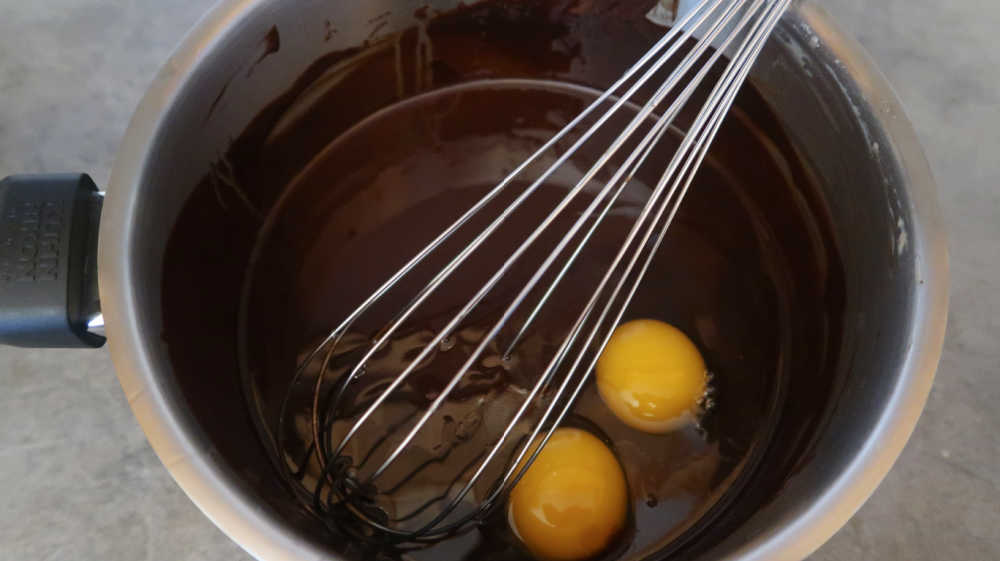 Whisking the eggs into the brownie batter